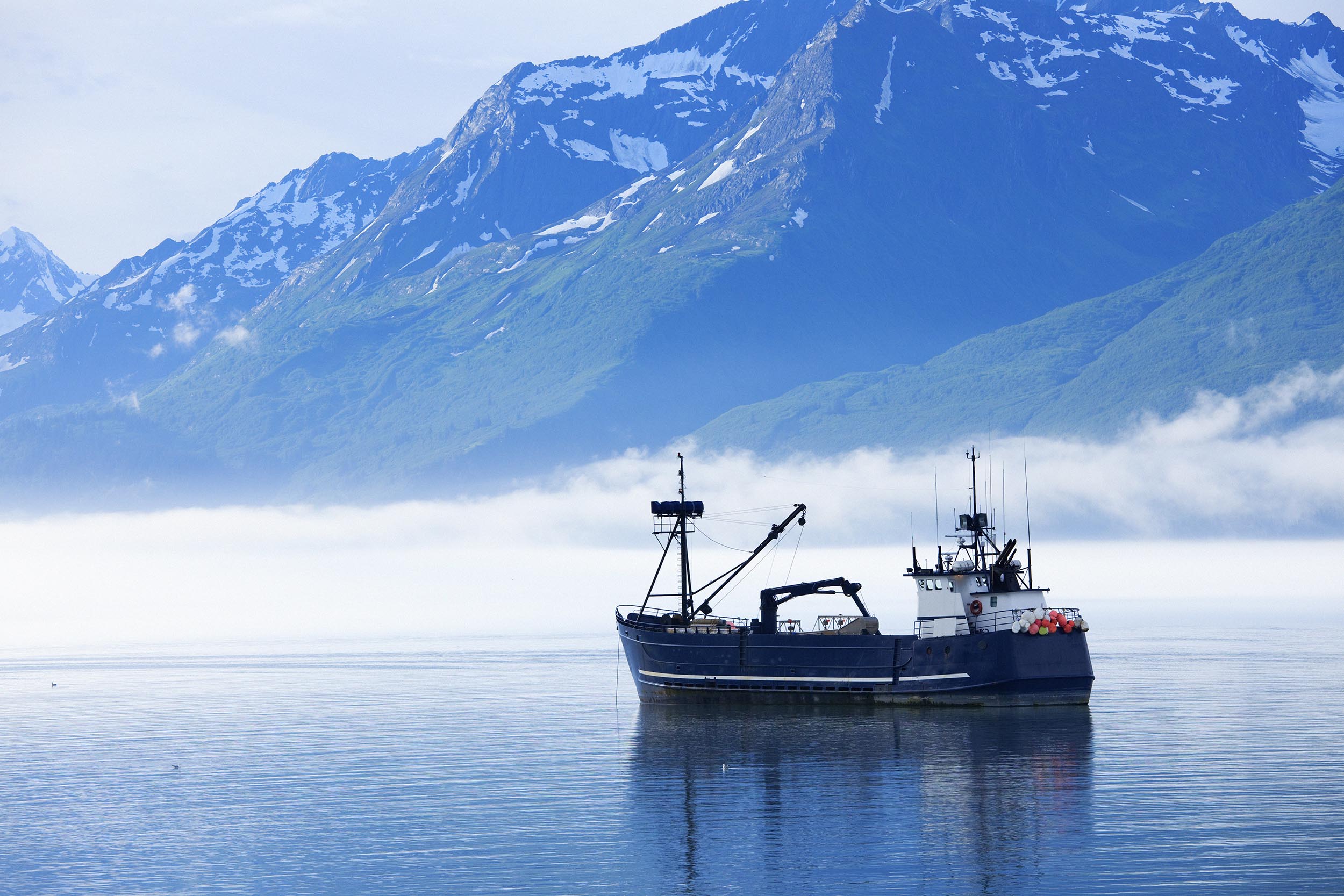 Large fishing boat anchored in Valdez, Alaska bay